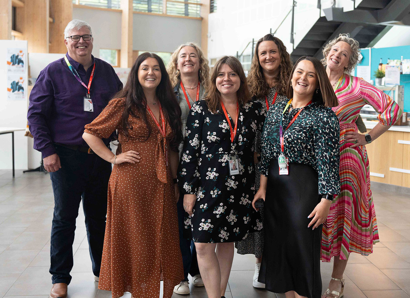 The CG Ambitions Team standing in the foyer of our college campus.
