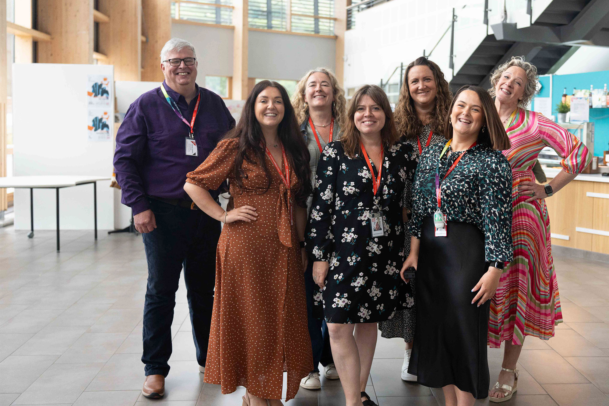 The CG Ambitions Team standing in the foyer of our college campus.