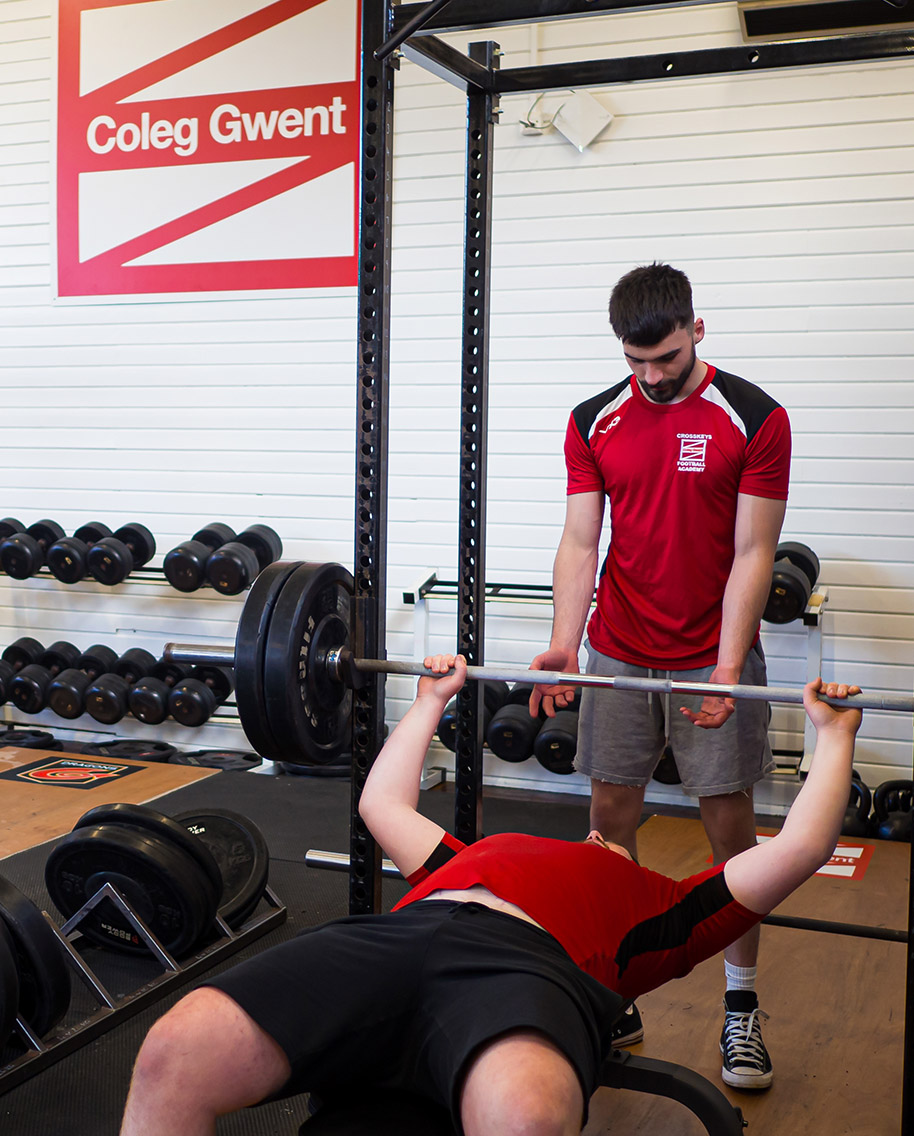 Students using weights at Crosskeys sports facility