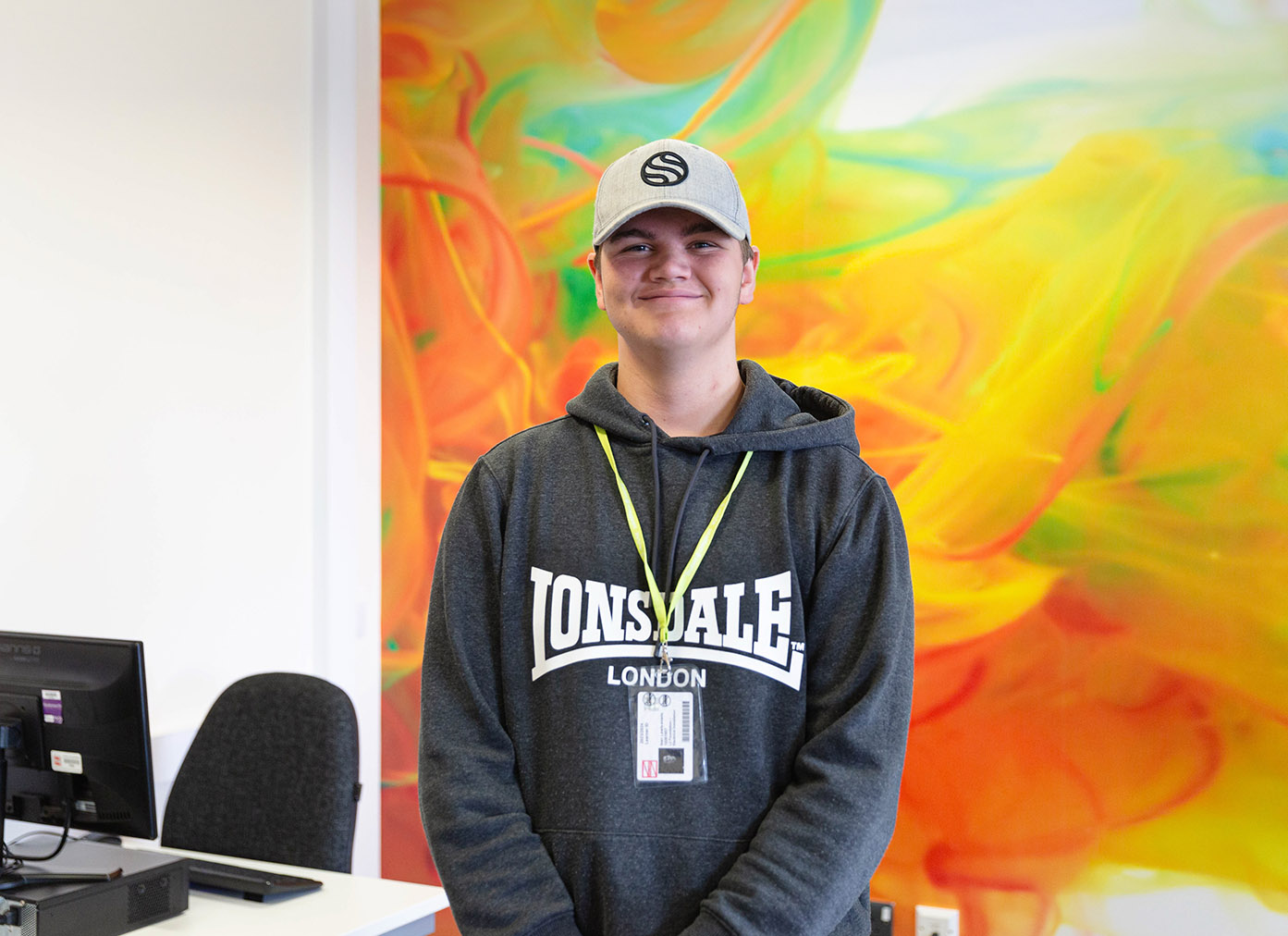 Learner standing smiling at the camera