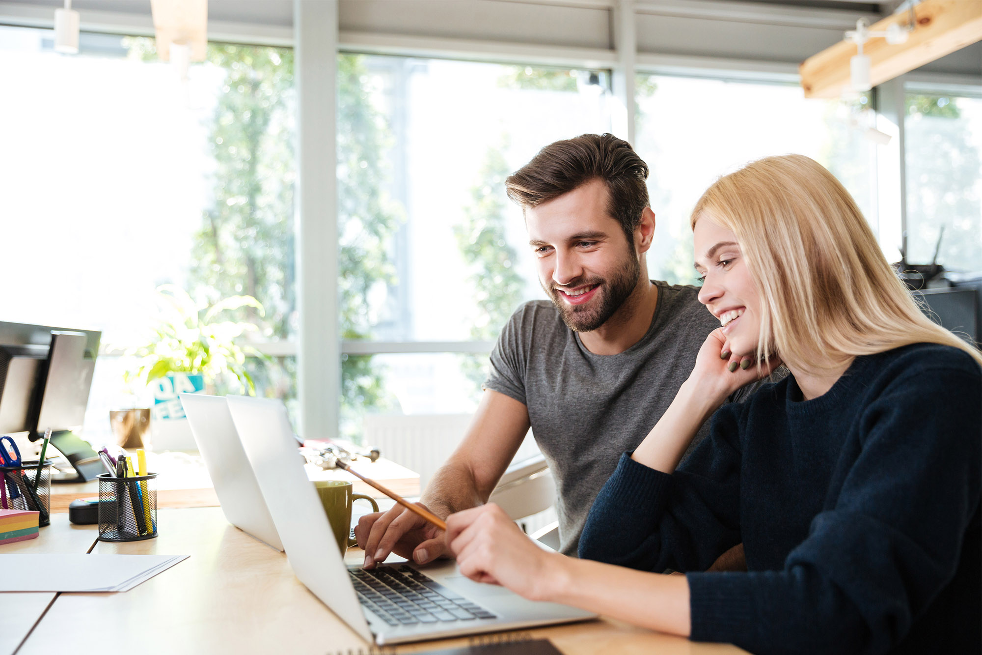 People looking at a computer