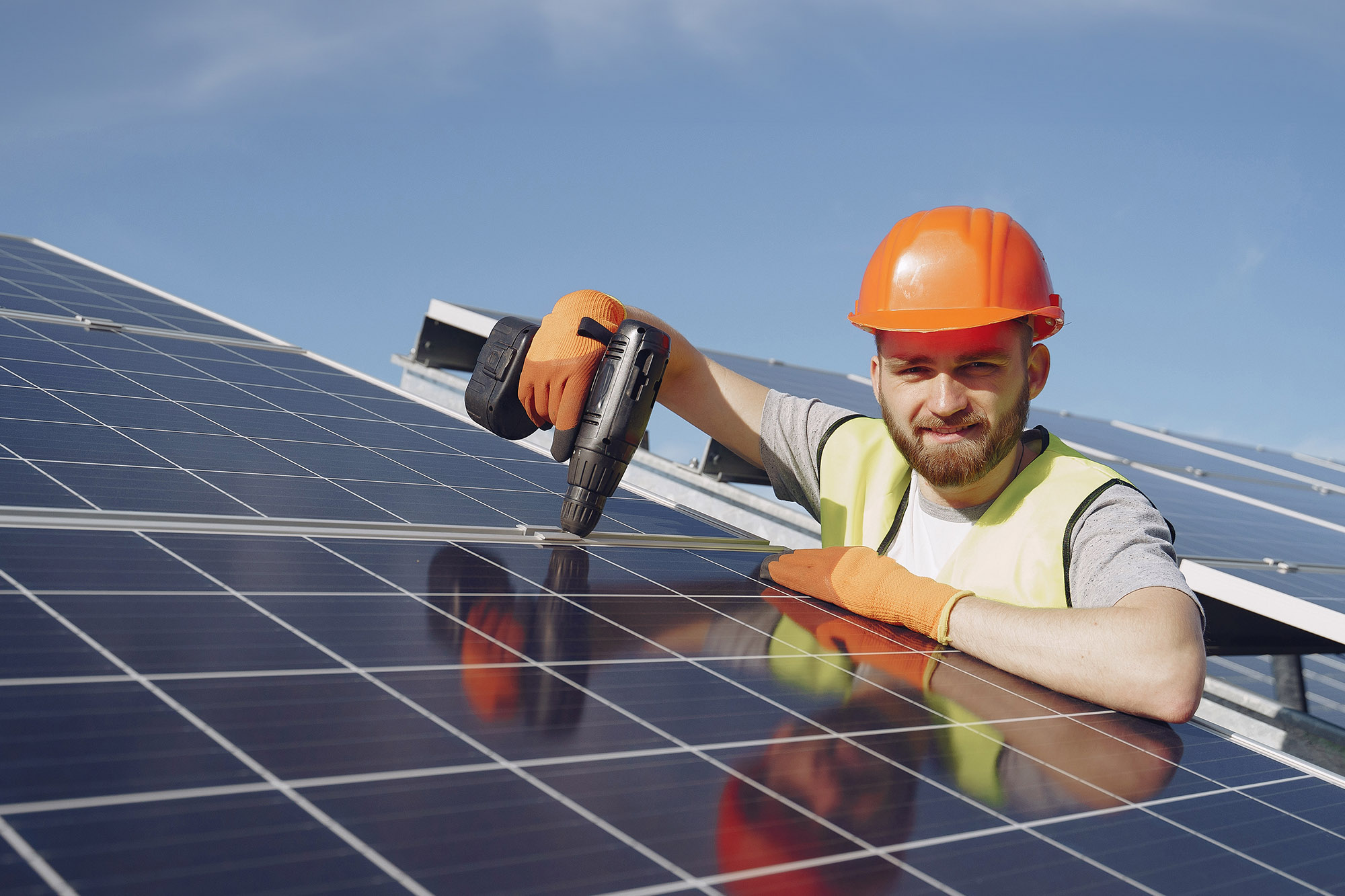 Man working on solar panels