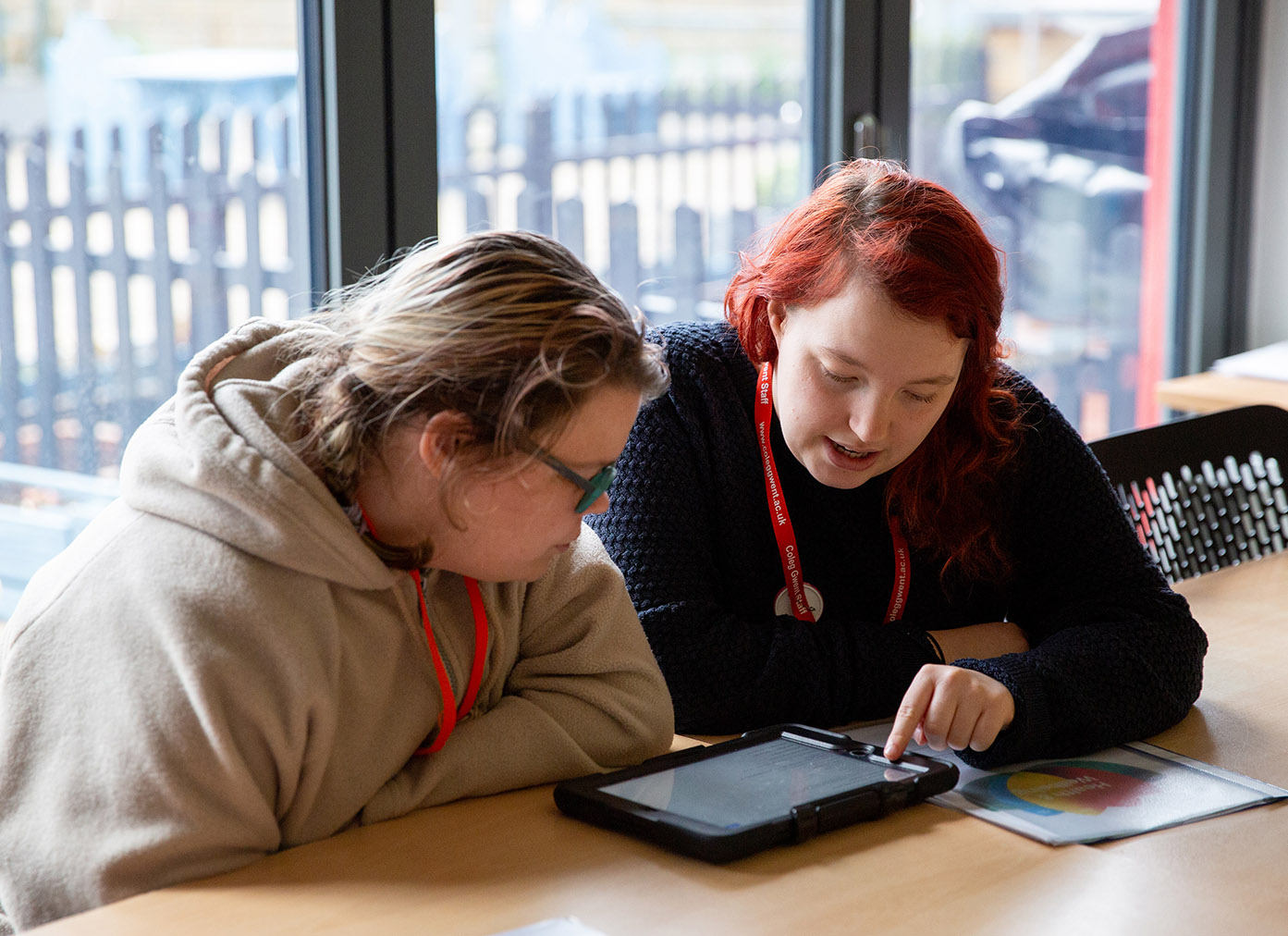 CG member of staff supporting a learner.