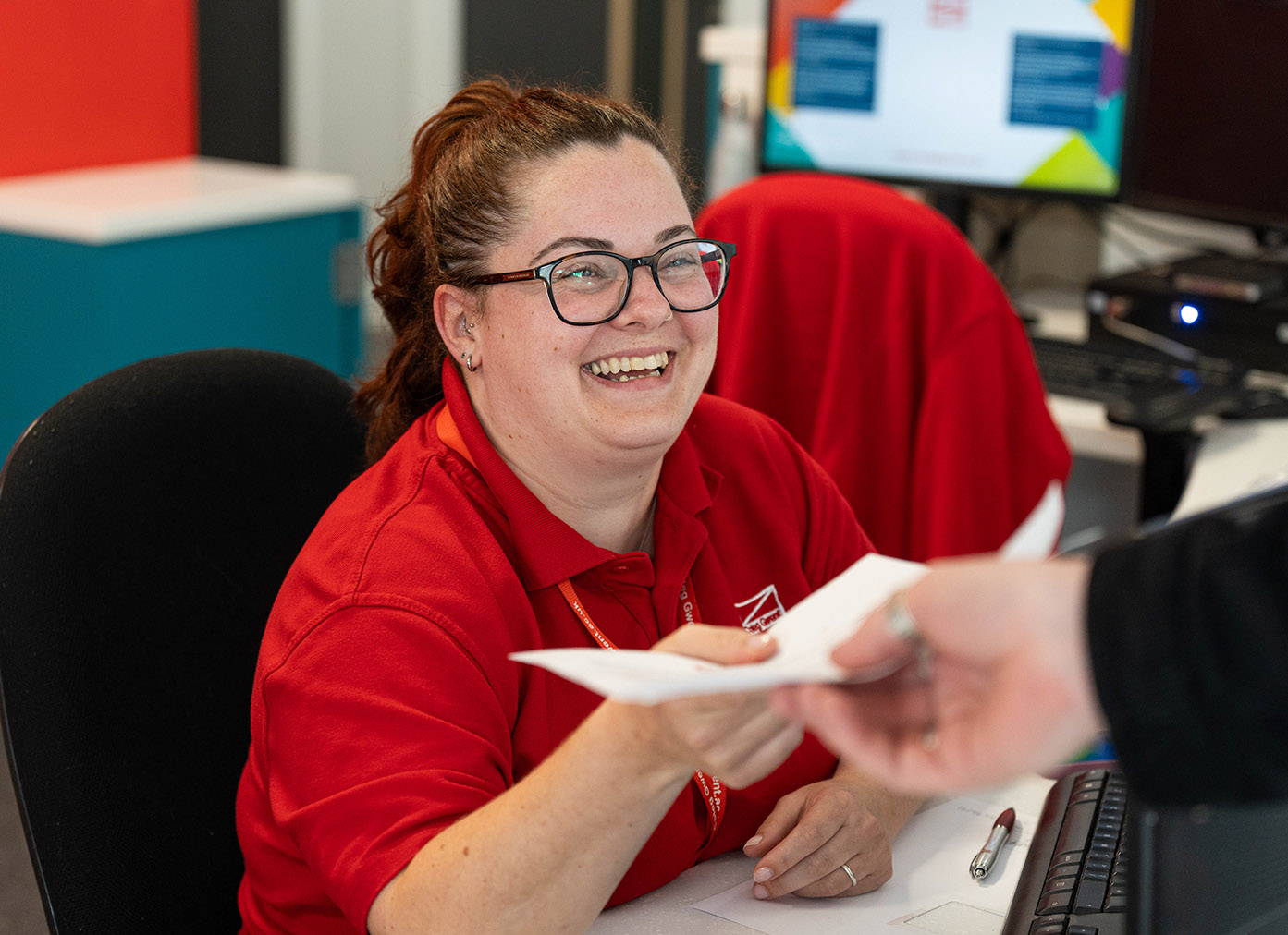 Reception staff member smiling