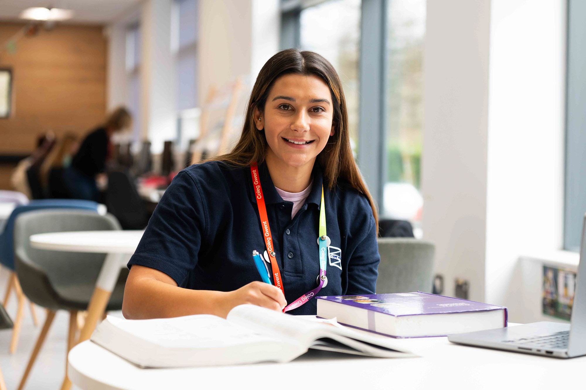 Mature student smiling at screen