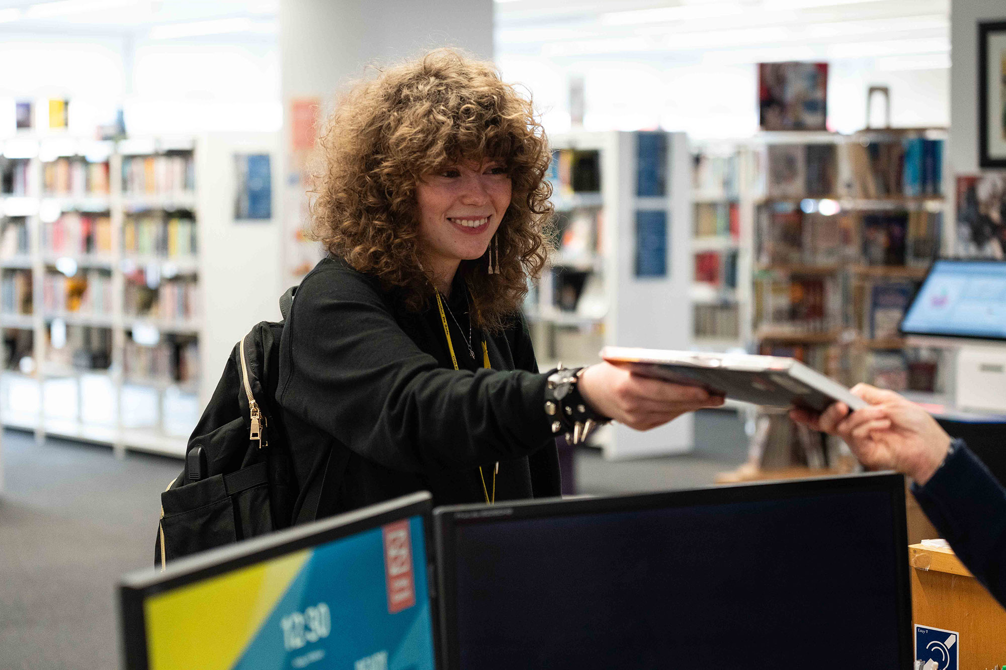 Student-Smiling-in-Library