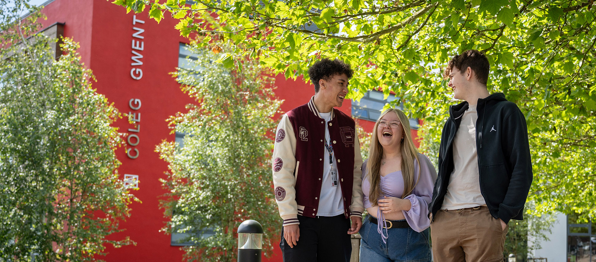 Students walking in the sun outside Crosskeys campus