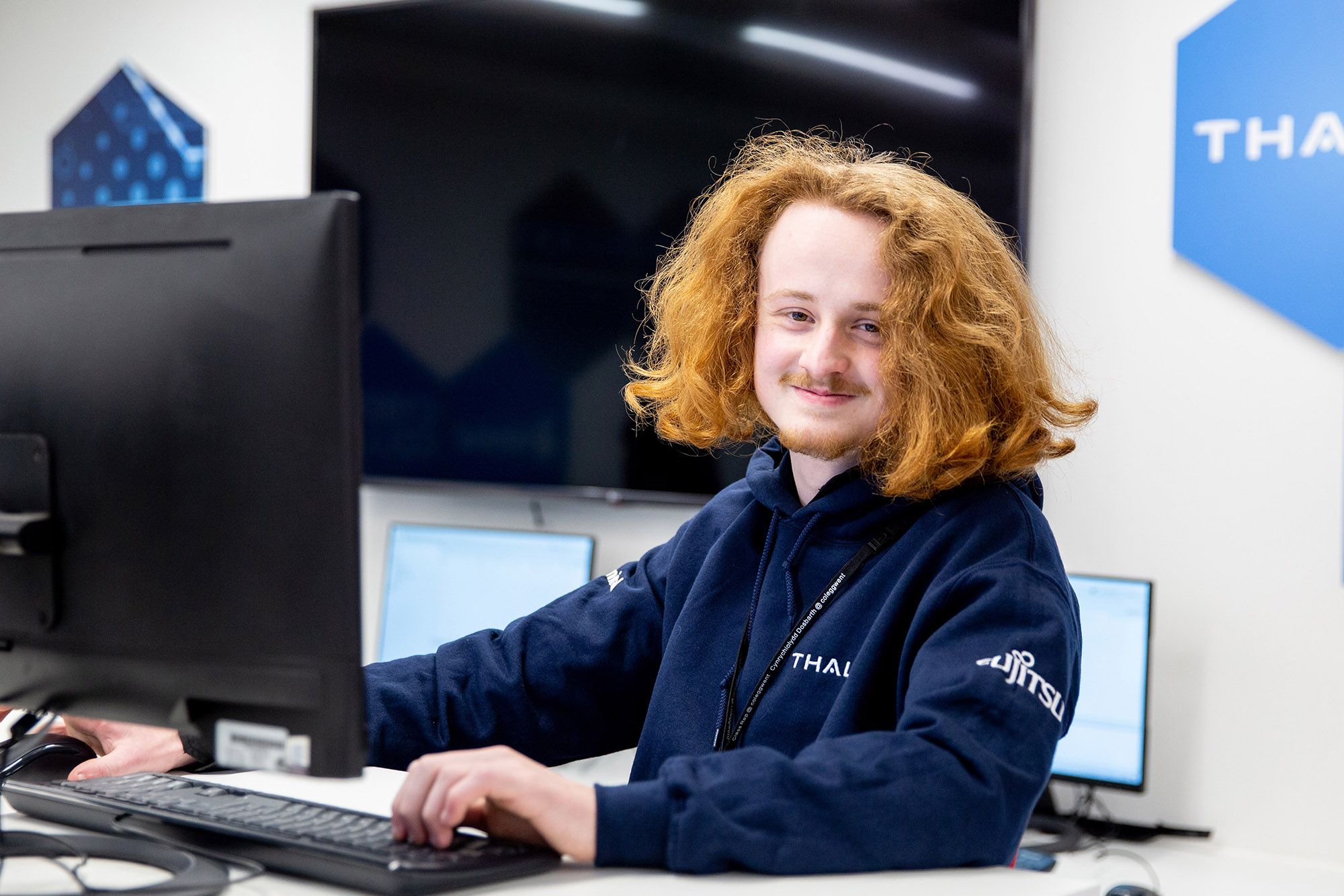 Student sat at a computer in class