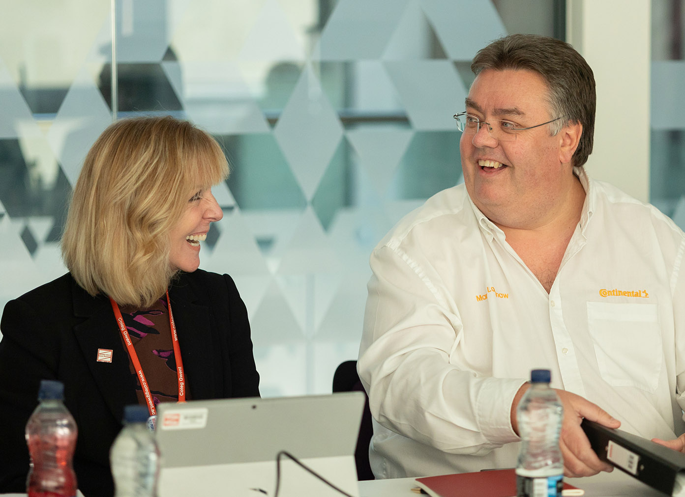 Governors smiling in a meeting