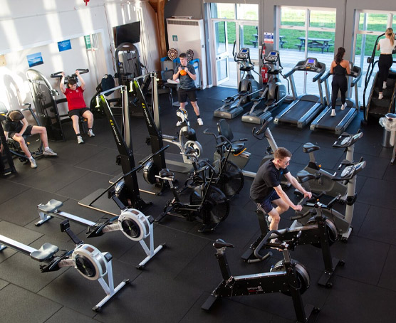 People using exercise equipment at Usk gym