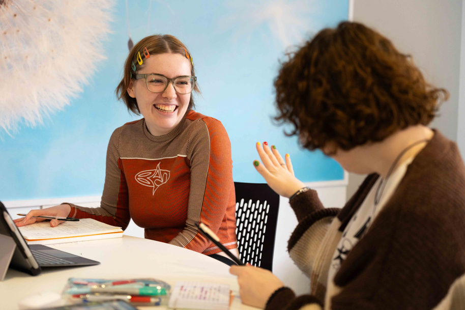 Students using HE Hub interior Usk