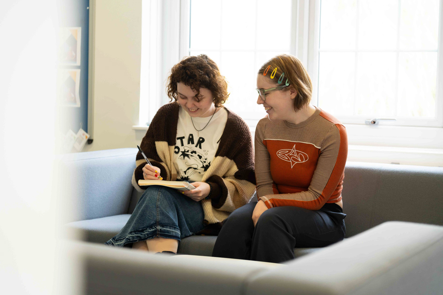 Students using HE Hub interior Usk