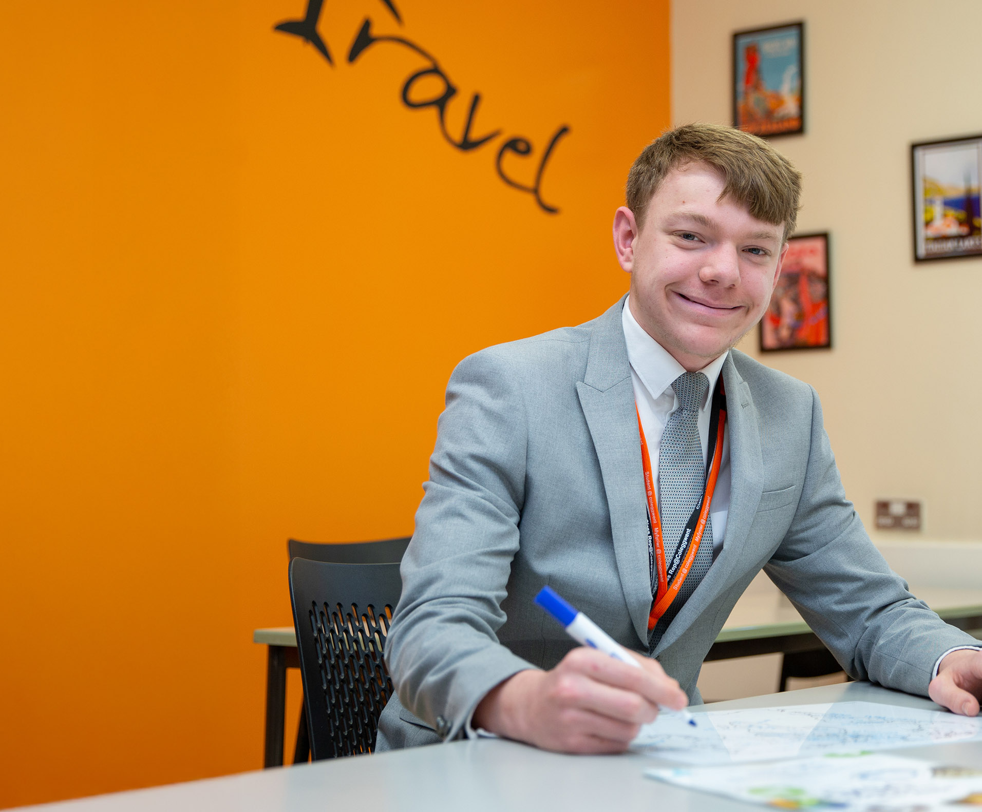 Travel and Tourism student working on flowchart in classroom