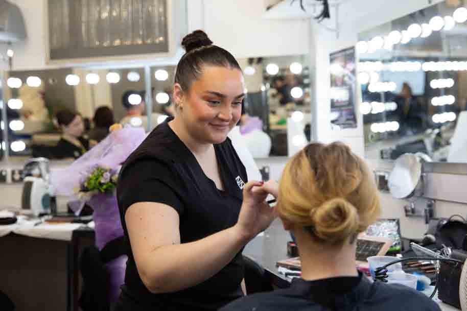 Beauty student doing makeup