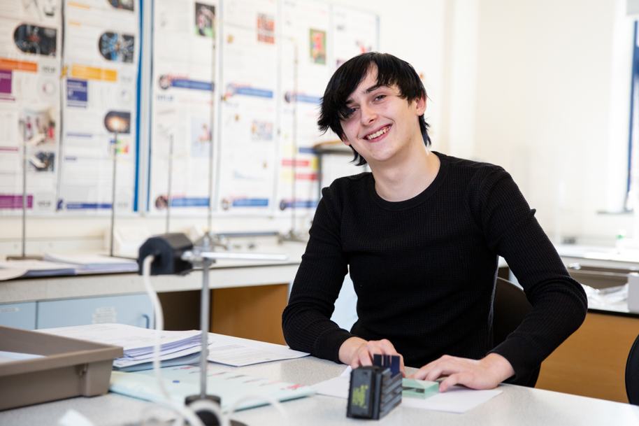 Science student smiling at camera
