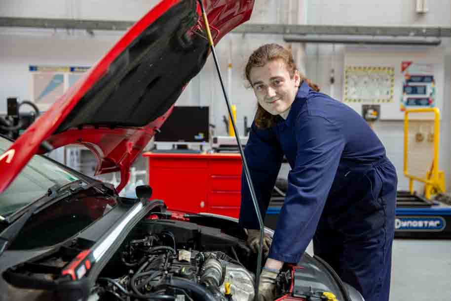 Student smiling in workshop