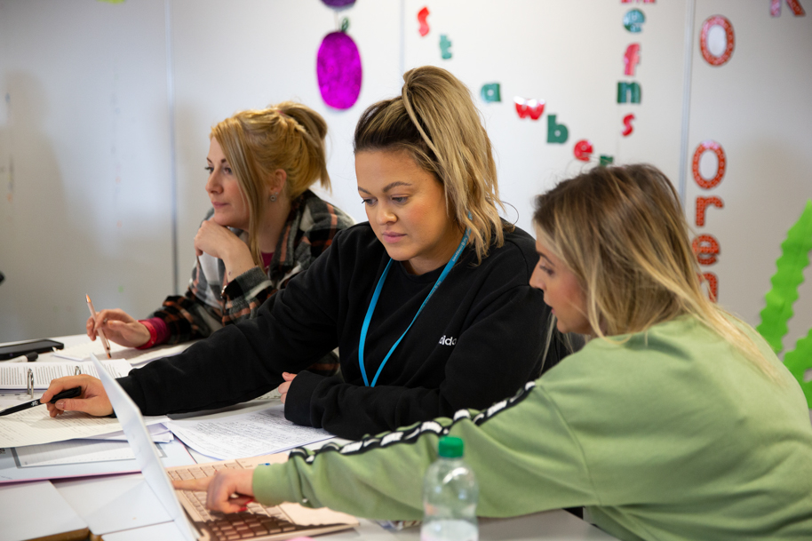 Students getting taught by tutor