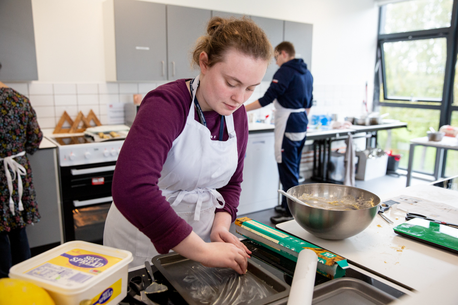 Student working in kitchen