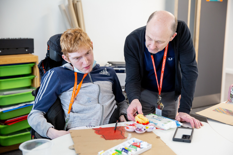 Student and tutor working together