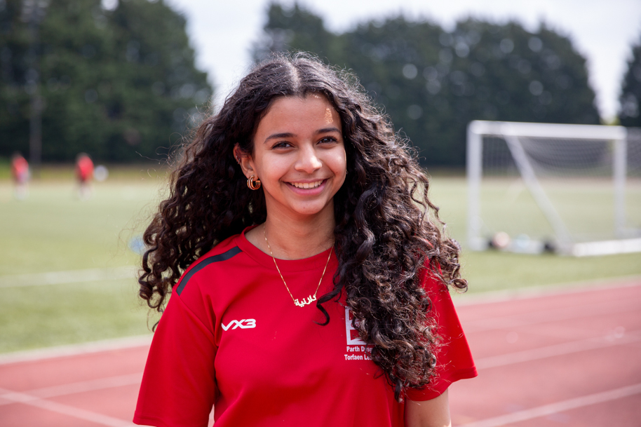 Student smiling outside