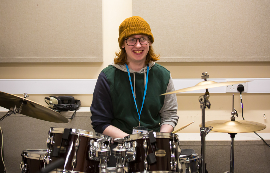 Drummer smiling at camera