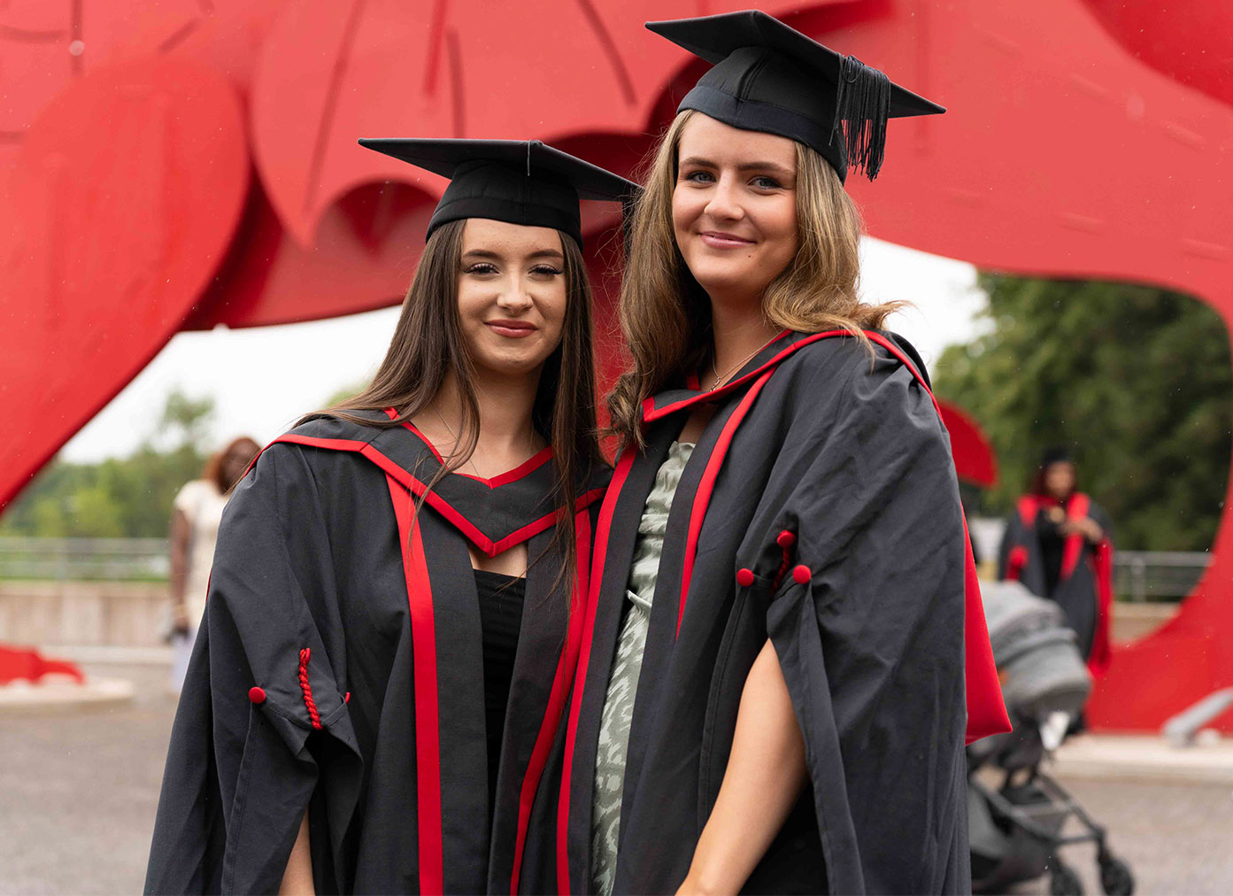 Students wearing gowns at graduation