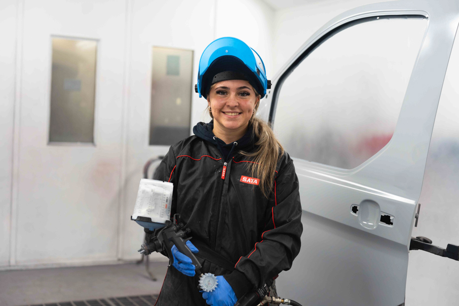 Student in spray booth