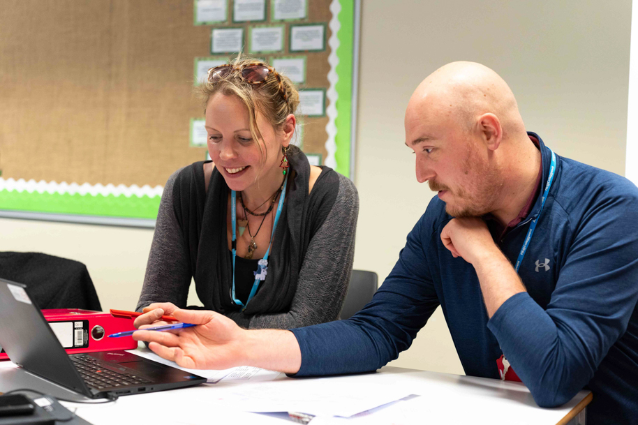 Student being taught by tutor