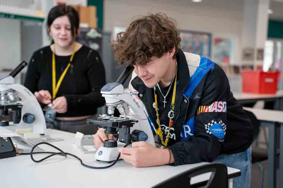 Student using microscope