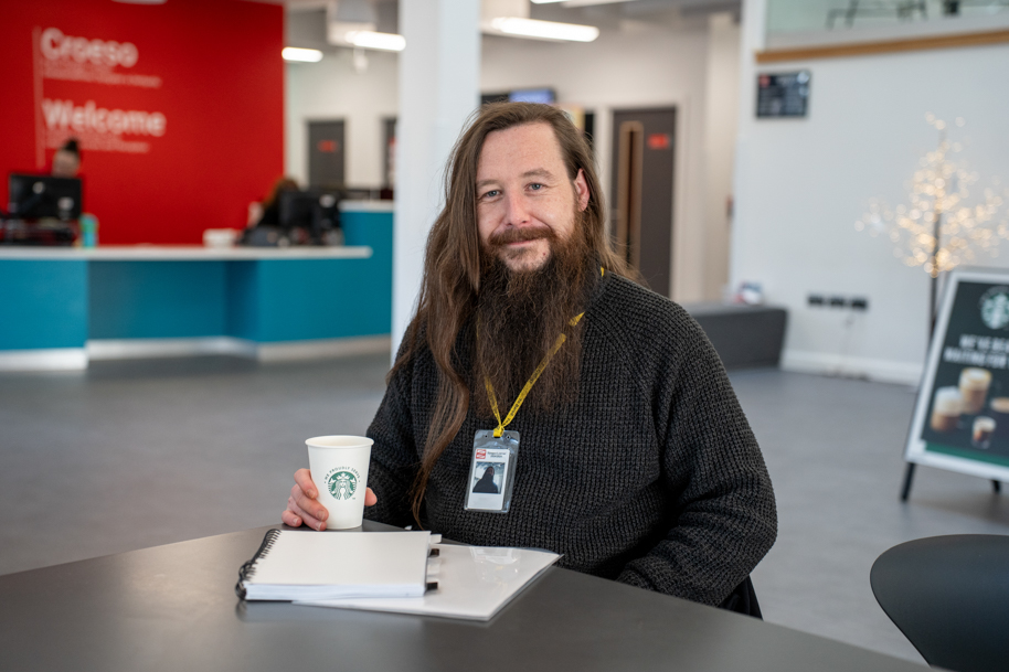 Mature student drinking coffee