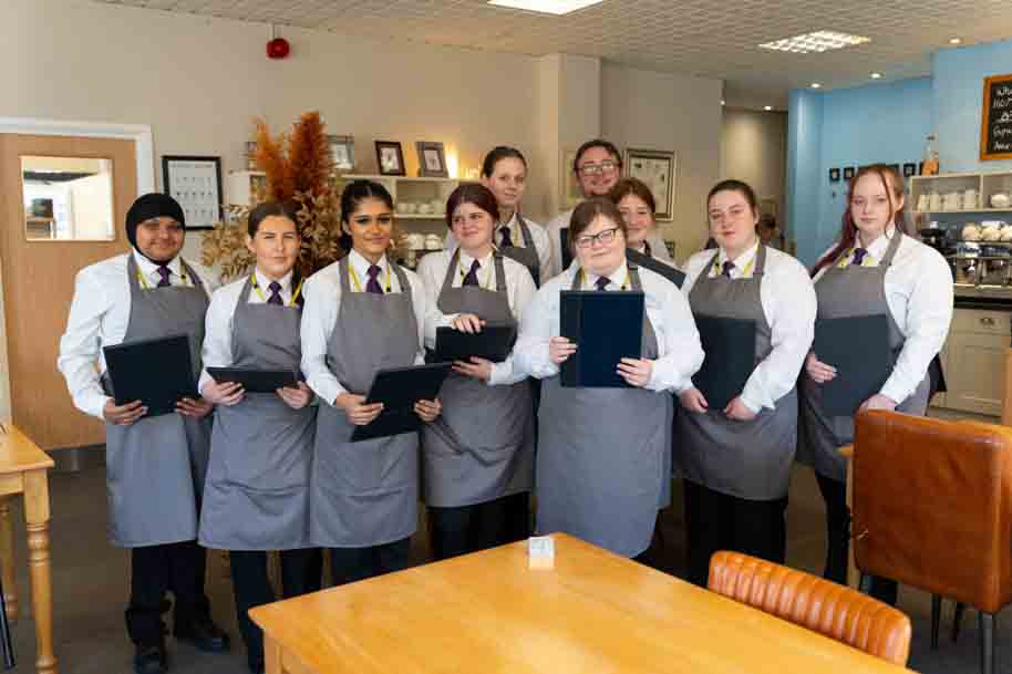 Group picture of Hospitality students smiling at camera