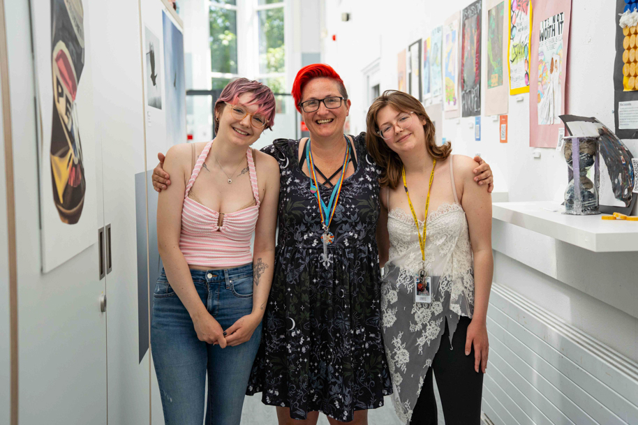 Parent and children all studying Higher education courses smiling