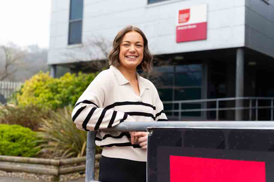 Alumni student outside smiling