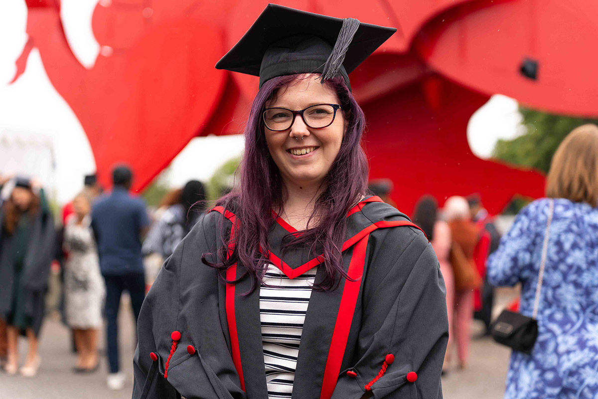 Student smiling at graduation
