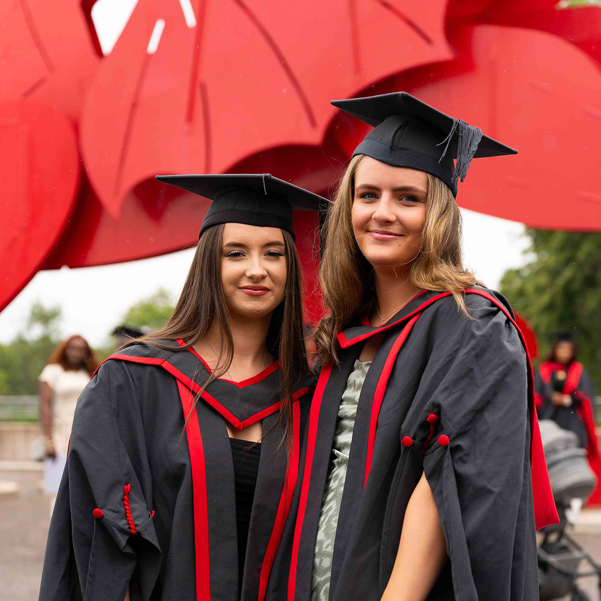 Students wearing gowns at graduation