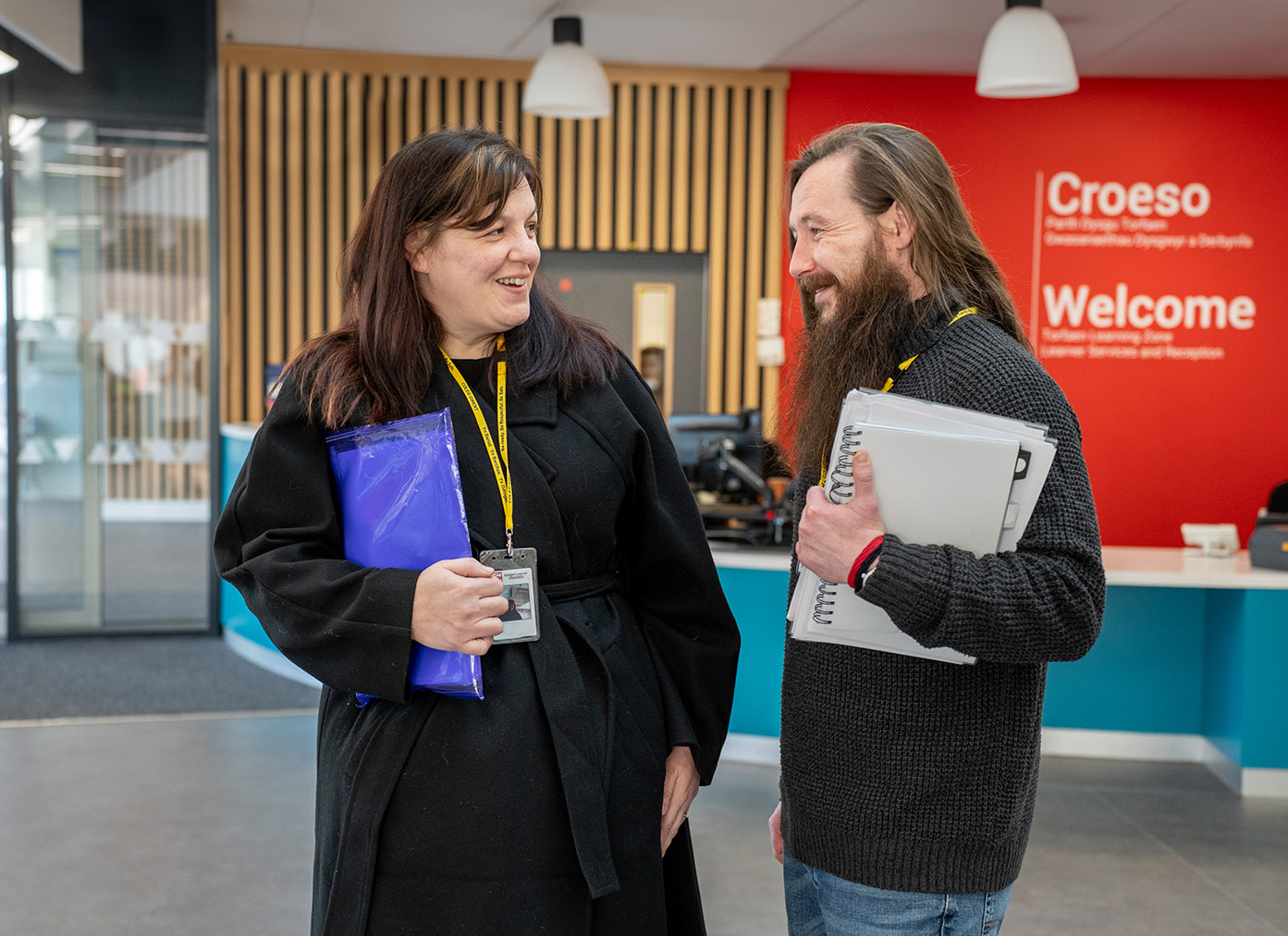 Two adult students chatting at TLZ