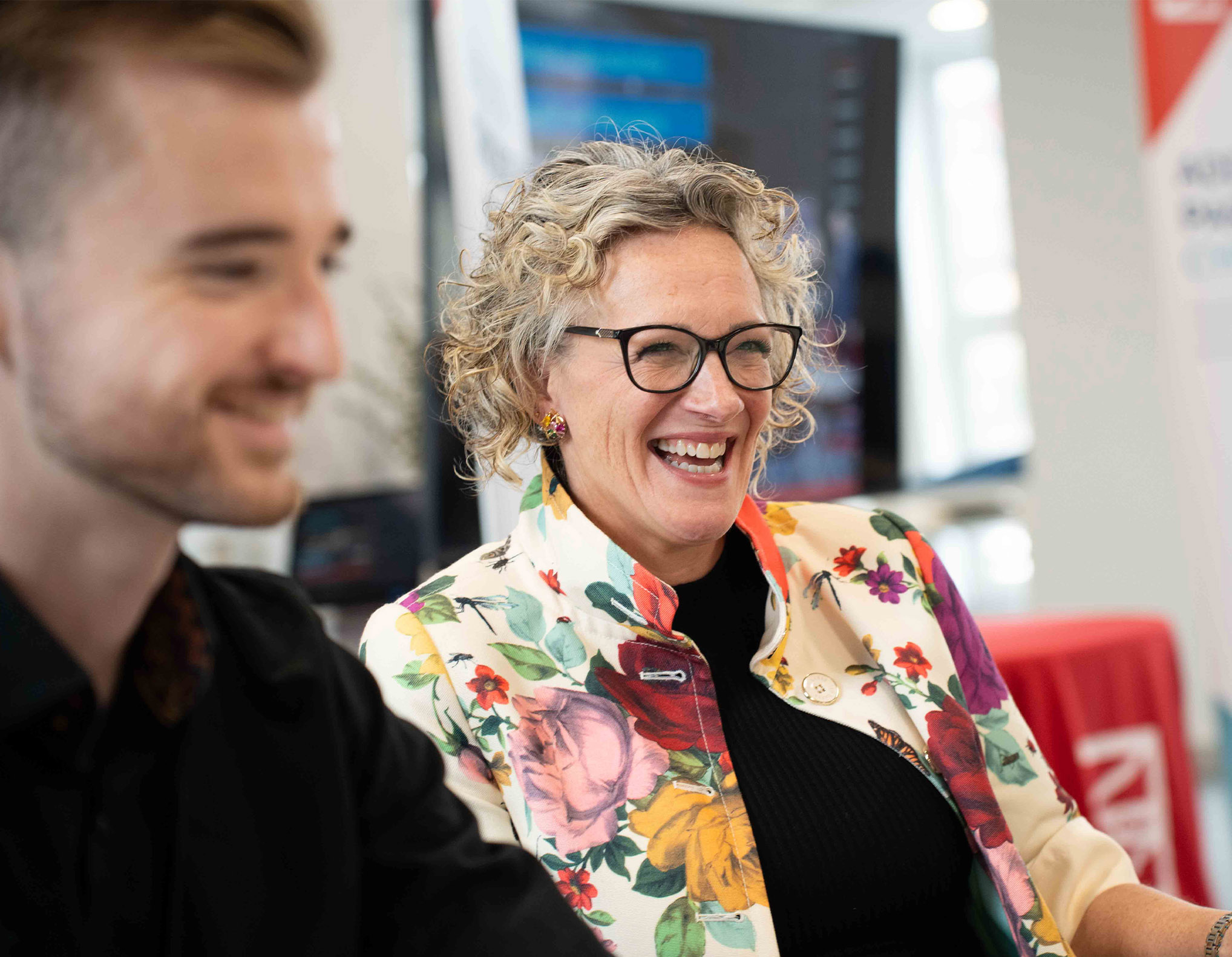 People laughing at an employer network event