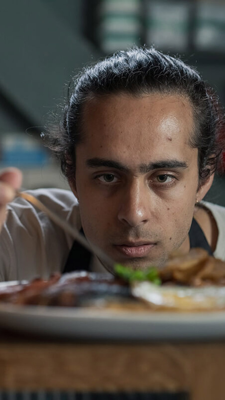Chef adding finishing touches to fry up