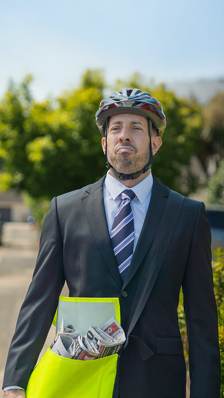 Man in suit on paper round
