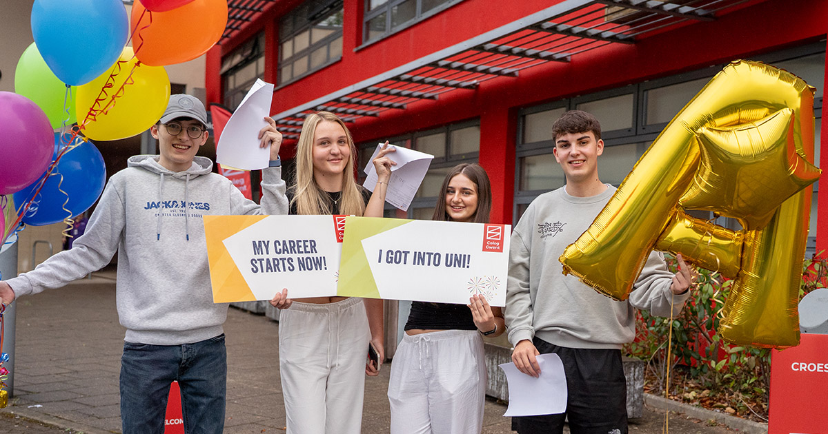 Students with balloons celebrating results day