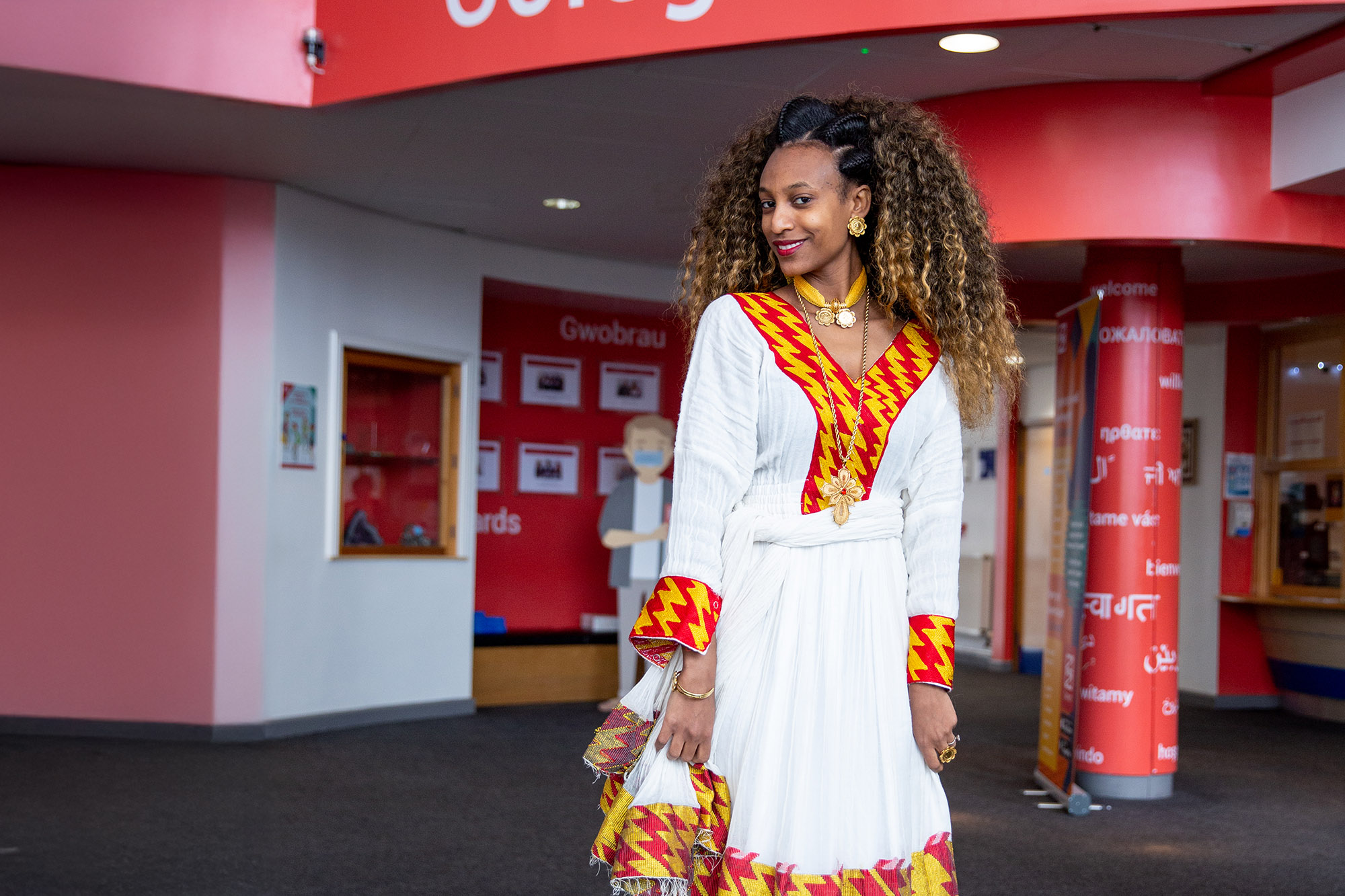 Adult learner in reception area of Newport Campus