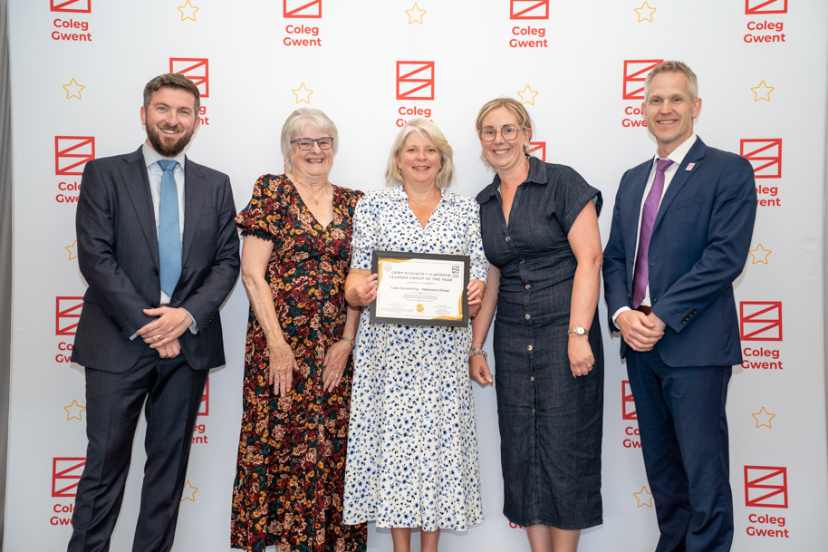 Adult learners receiving an award