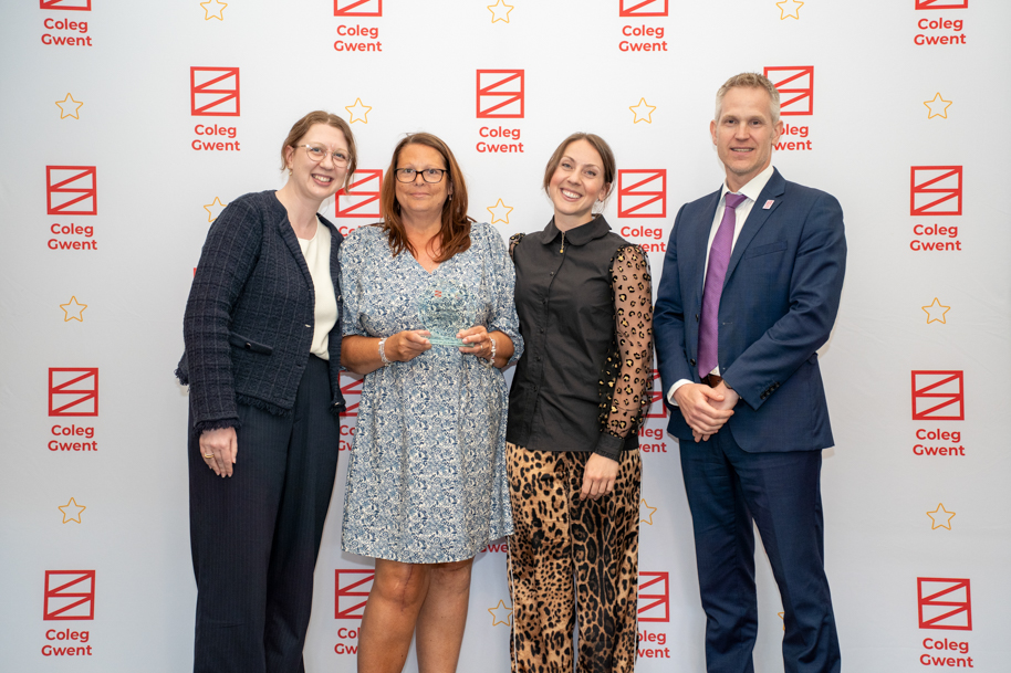 Adult learners receiving an award